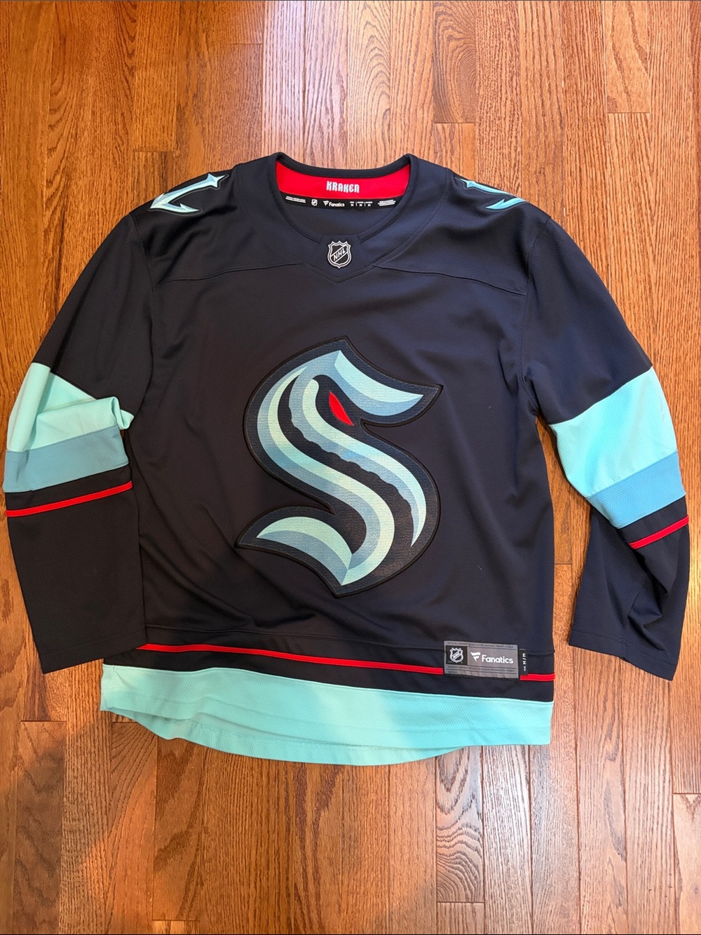 Fanatics Navy, Seafoam, and Red Seattle Kraken Jersey Detail